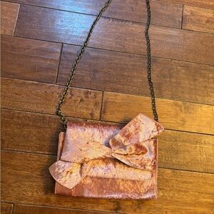 Anthropologie pink velvet bow clutch